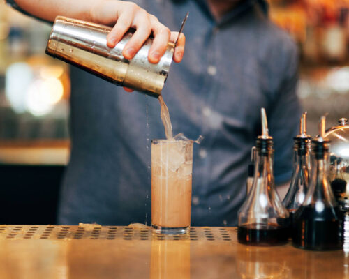 man pouring cocktail